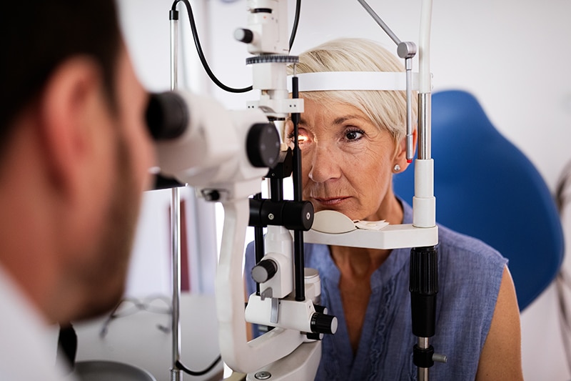 Older woman having her eyes examined for glaucoma